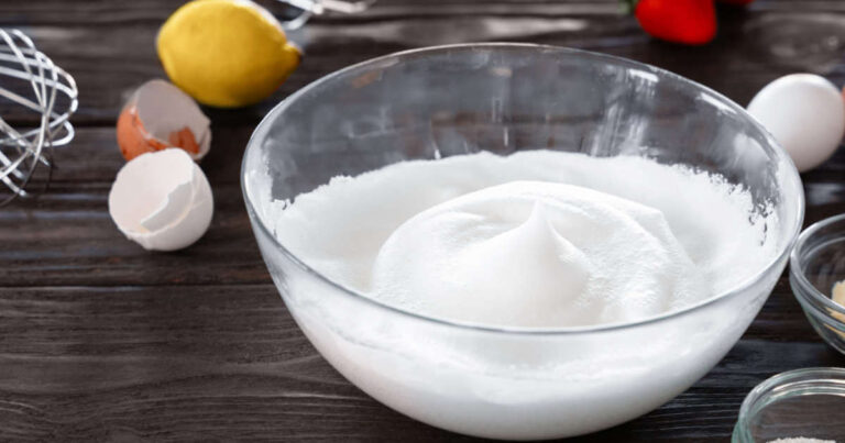 Egg whites or albumen whipped in a bowl to create a foam for baking